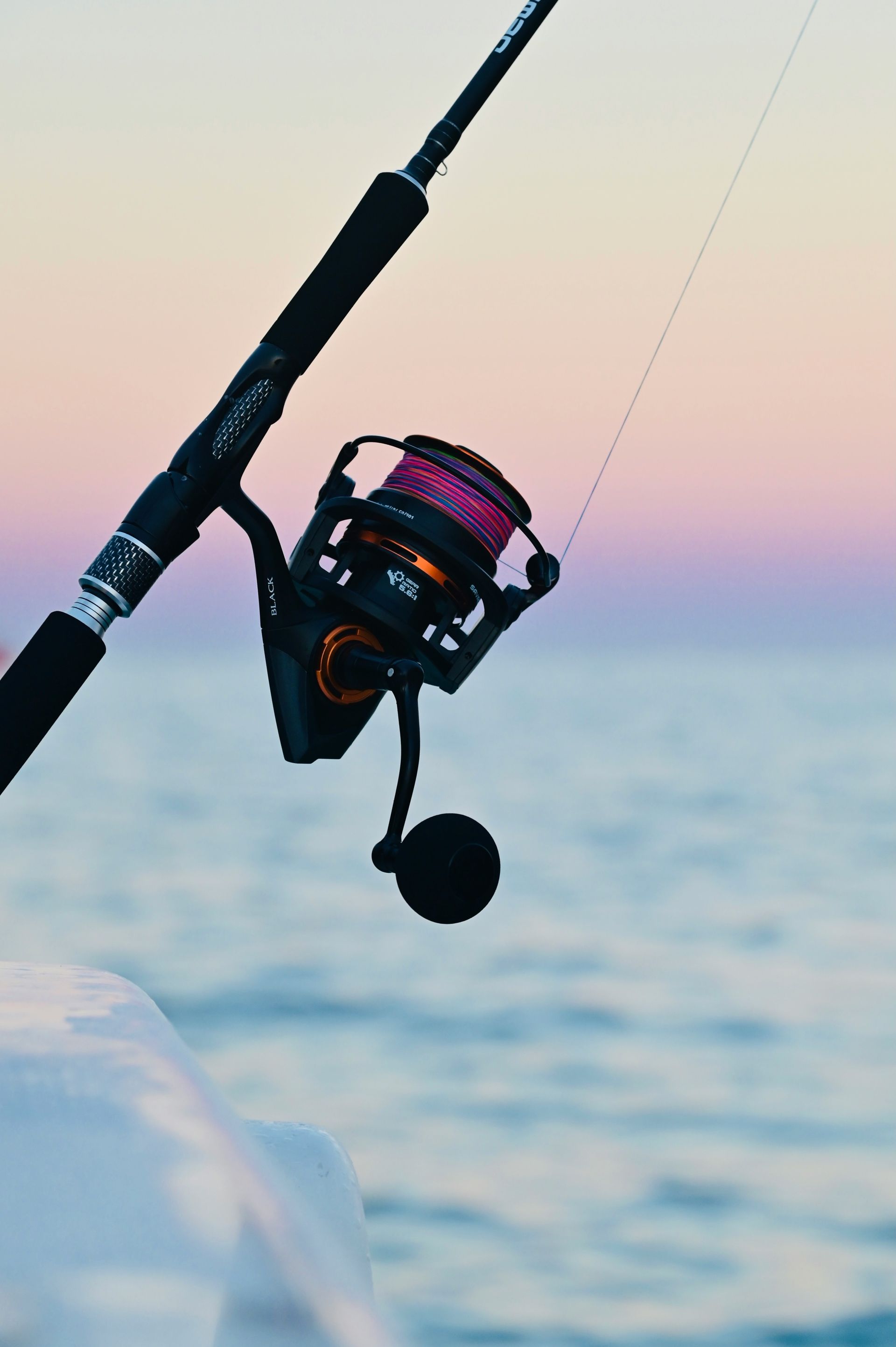 black and silver fishing rod